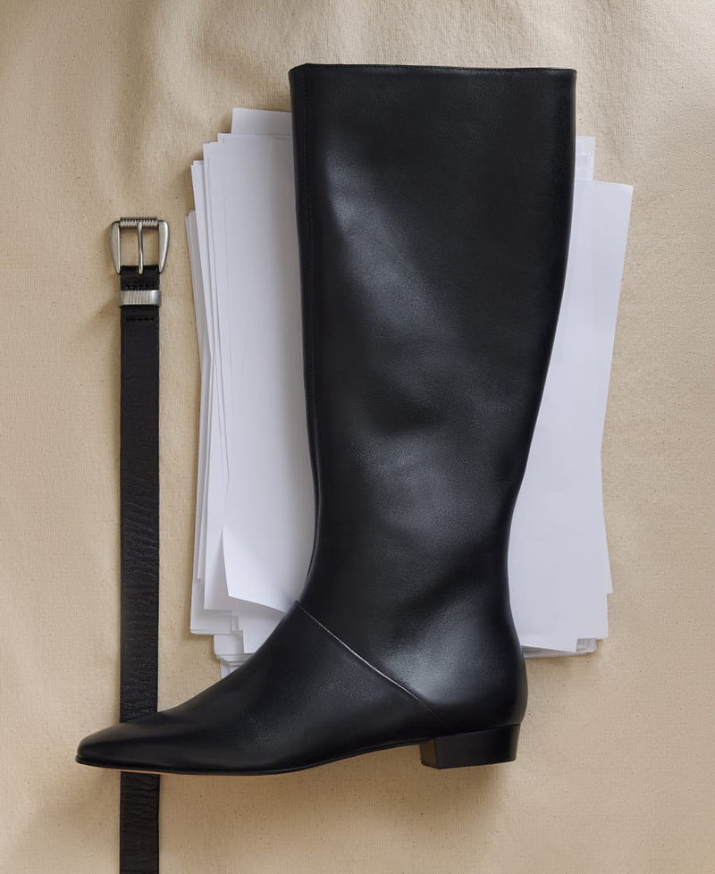 Bernardo black leather knee-high flat boot on canvas with a black leather belt