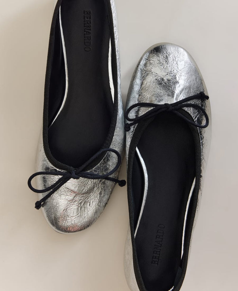 Bernardo silver metallic leather ballet flats with black bow ties
