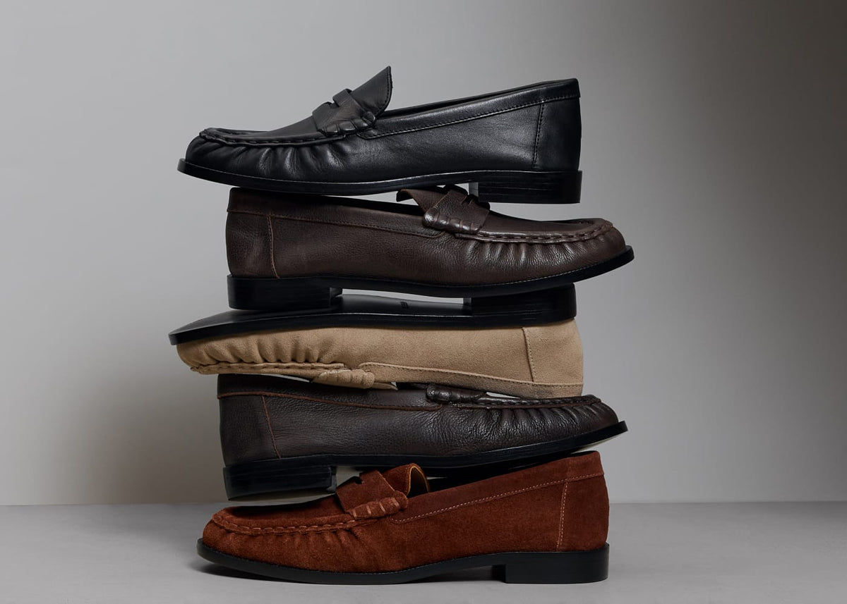 Stack of Tilda loafers in black and brown leather and suede